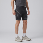 Three-quarter side view of the grey padded cycling liner shorts worn, mid-thigh leg length