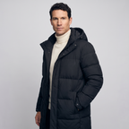 Man wearing the black long puffer coat, three-quarter side view