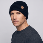 Man wearing the black winter hat, three-quarter side view