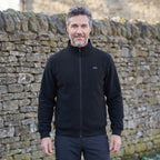 Heated jacket worn by a man, front view, zipped up with stand collar
