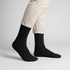 Black wool socks worn by a man