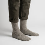 Light grey wool socks worn by a man