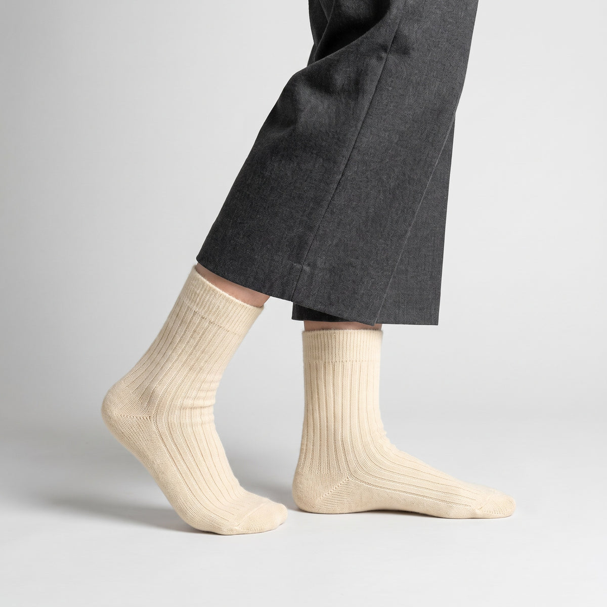 Cream wool socks worn by a woman