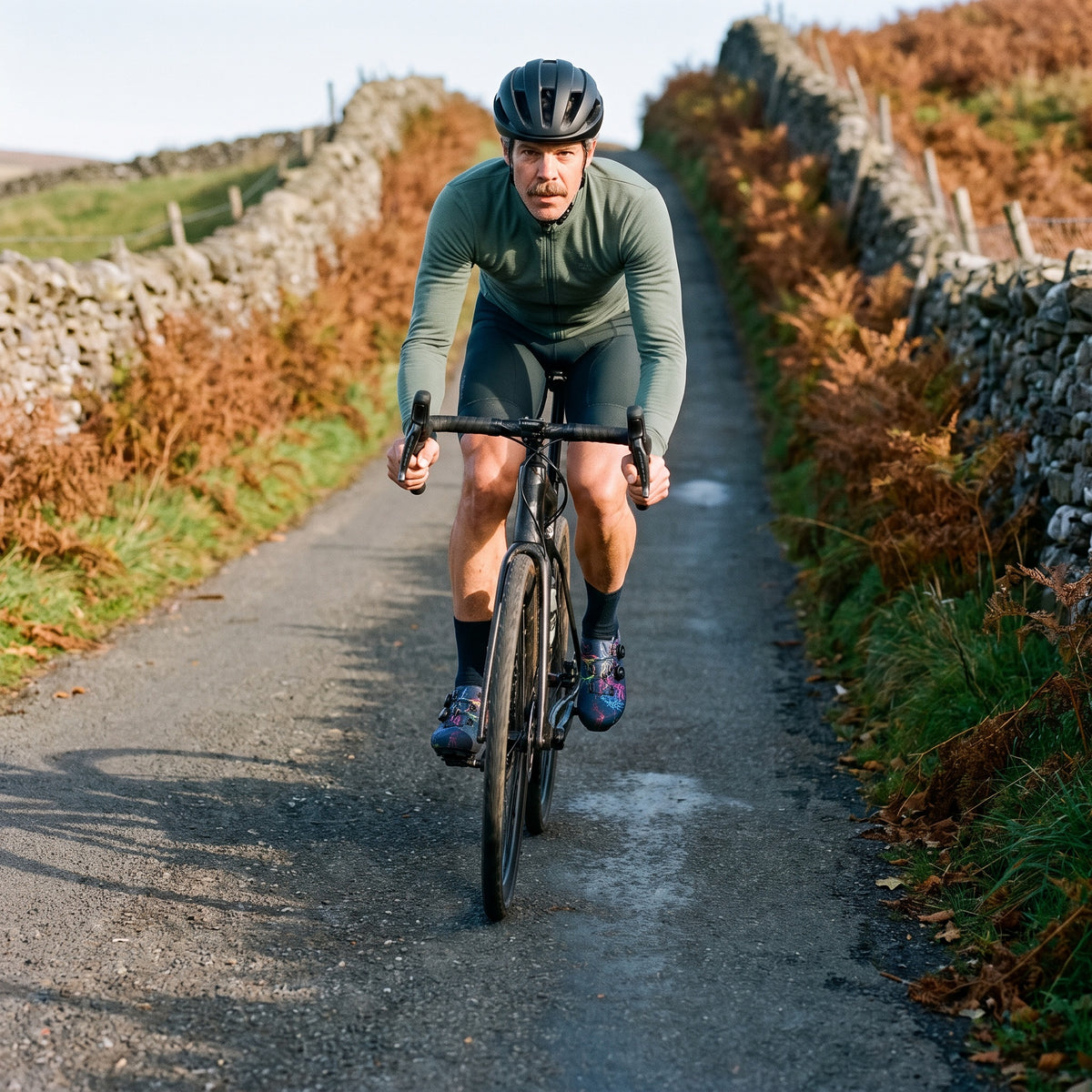 Cyclist on a Yorkshire Dales lane wearing Dark Blue dial cycling shoes