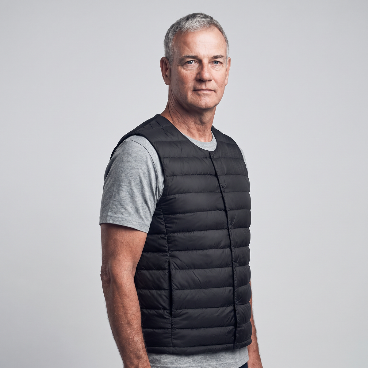 Men's Terrabound down gilet in Black, three-quarter side view