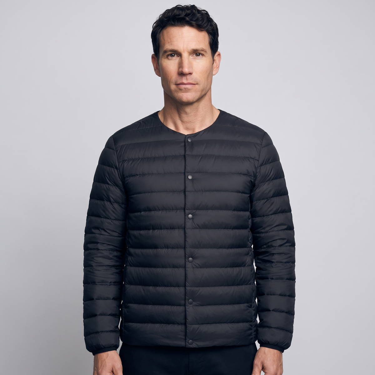 Terrabound Men's Down Jacket in Black, convertible collar closed, worn front view