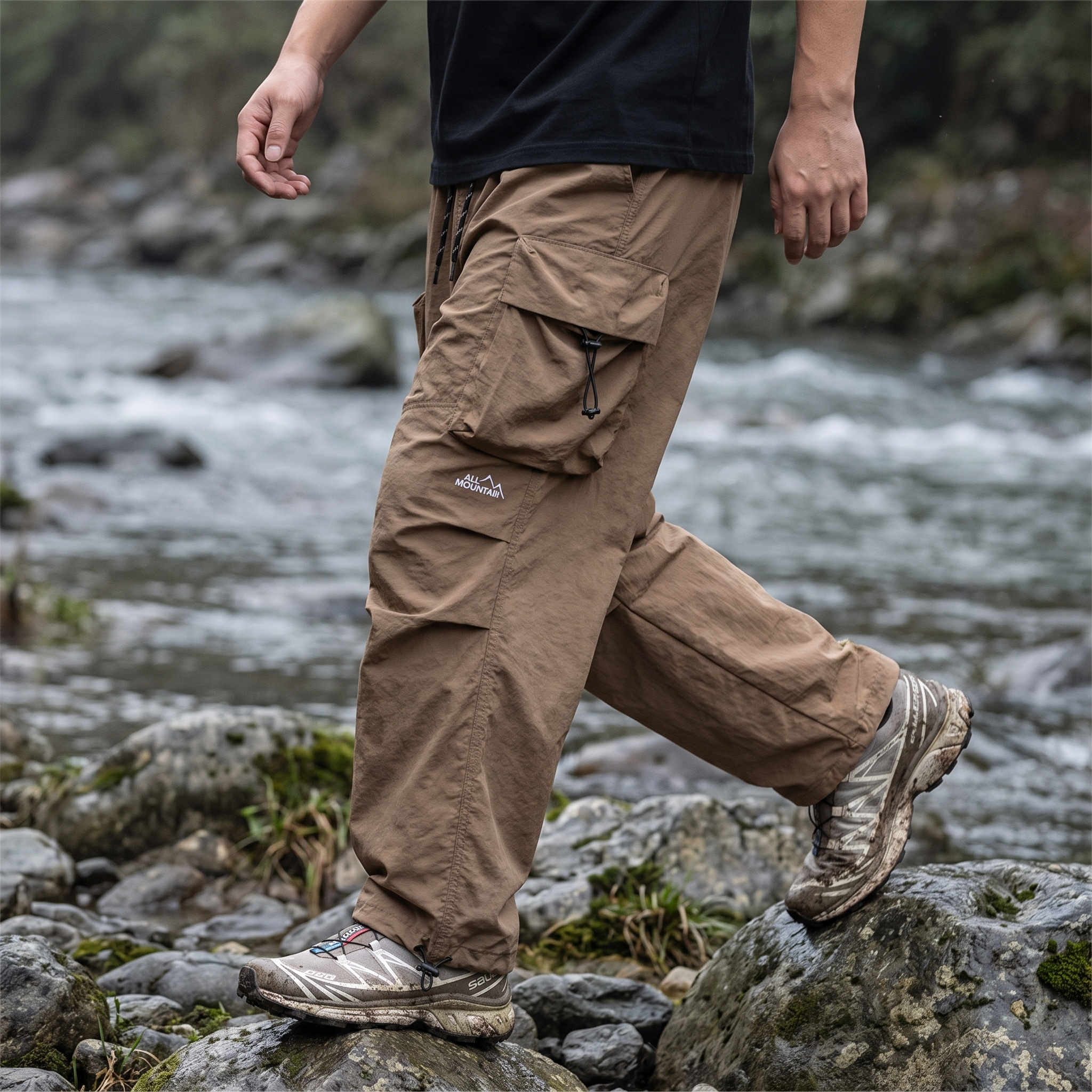 Wide-leg movement crossing a rocky riverbank