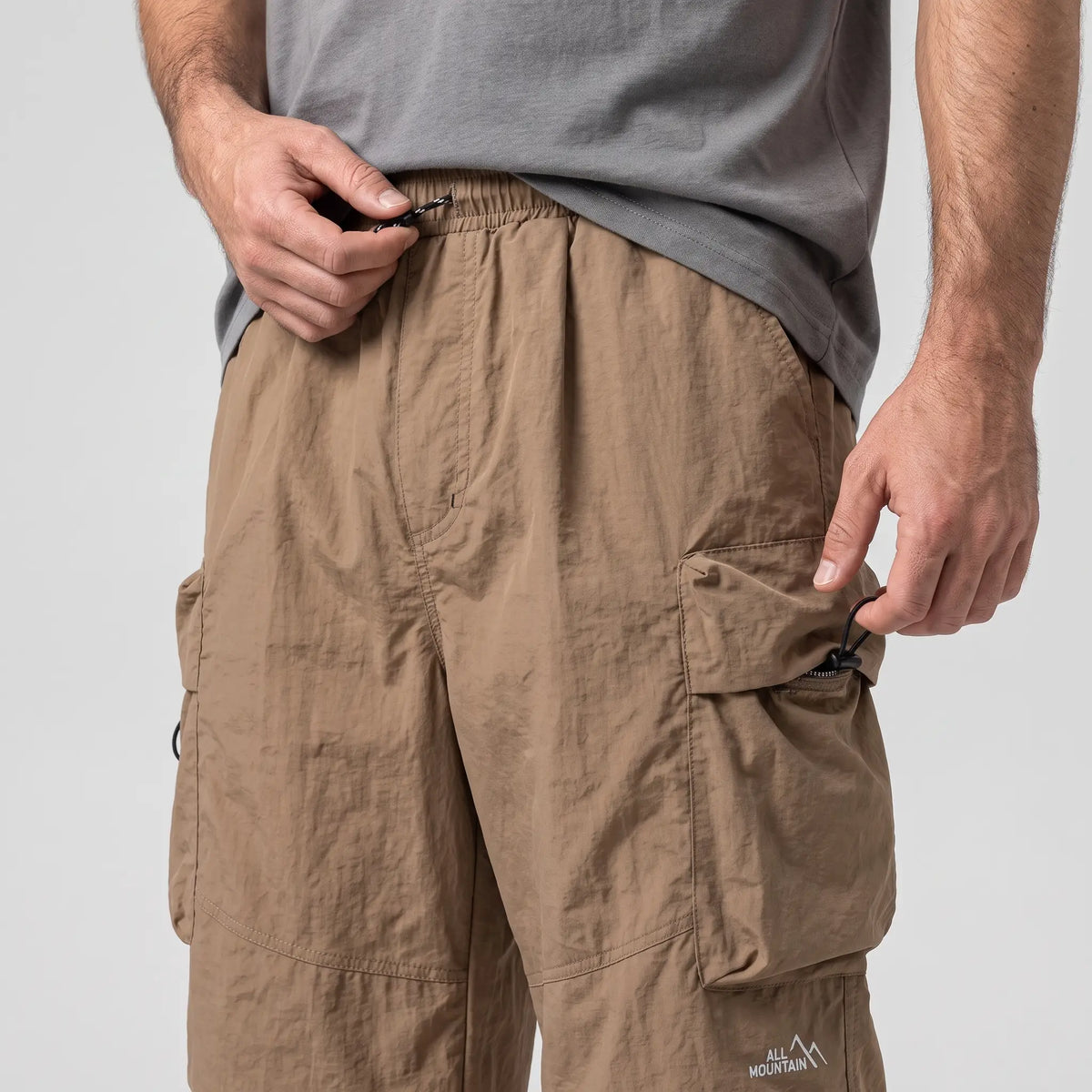 Close-up of the waistband drawstring and thigh cargo pocket