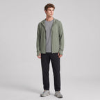 Man wearing the army green full-zip sun hoodie, full body