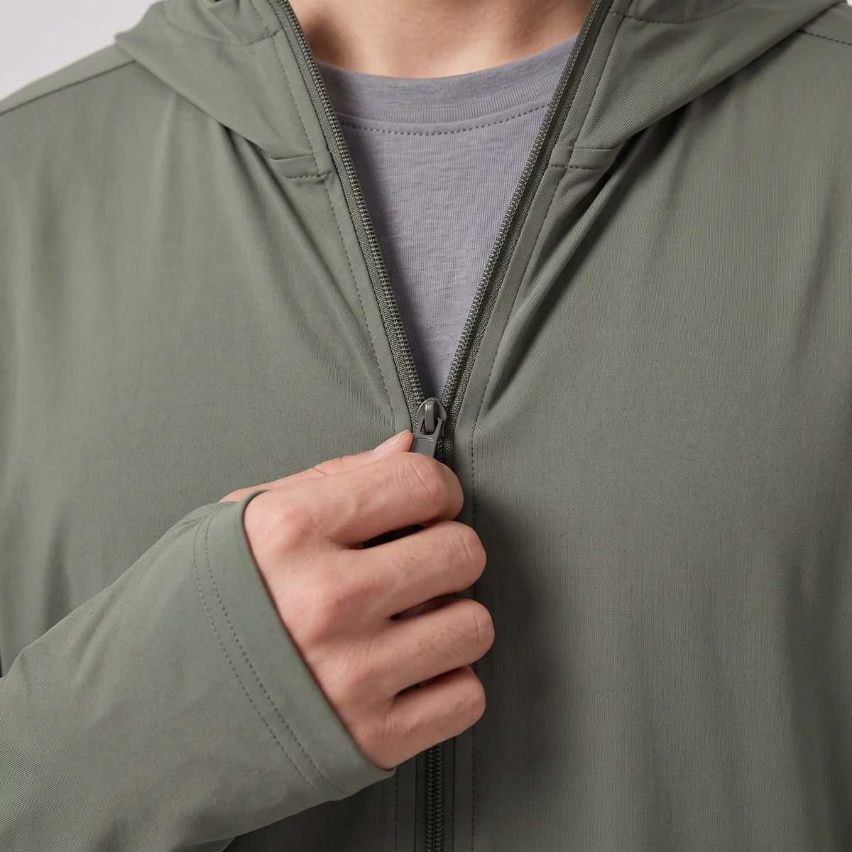 Close-up of the front zip pulled open partway for ventilation