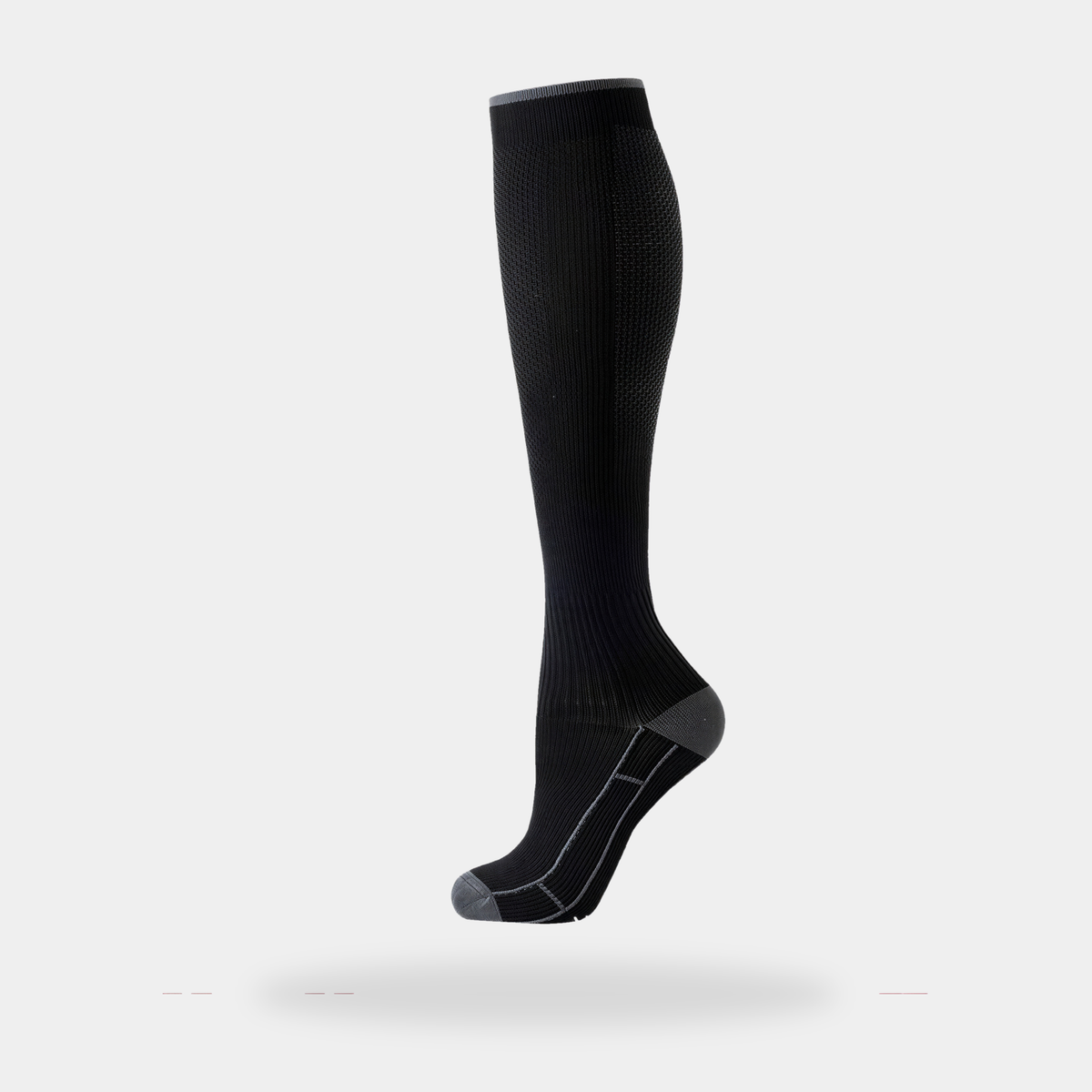 Knee-high sports socks in black, worn single