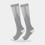 Knee-high sports socks in grey, worn pair, mesh shin panel visible