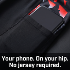 Phone slipped into the open hip pocket on the outer thigh