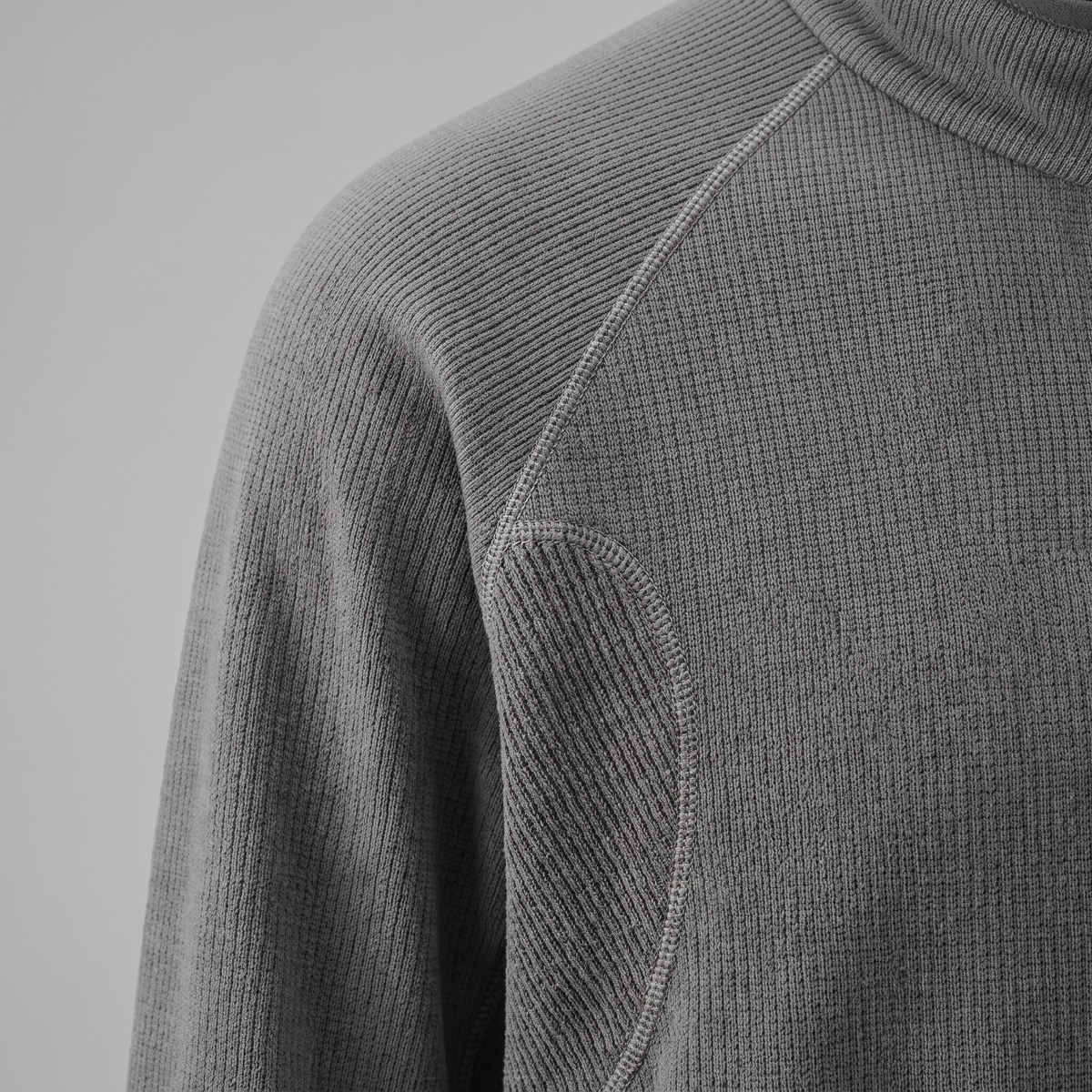 Close-up of the textured knit fabric and ribbed panel on the Terrabound half-zip fleece