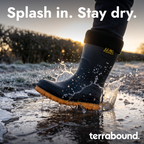 Fleece lined welly splashing into an icy puddle