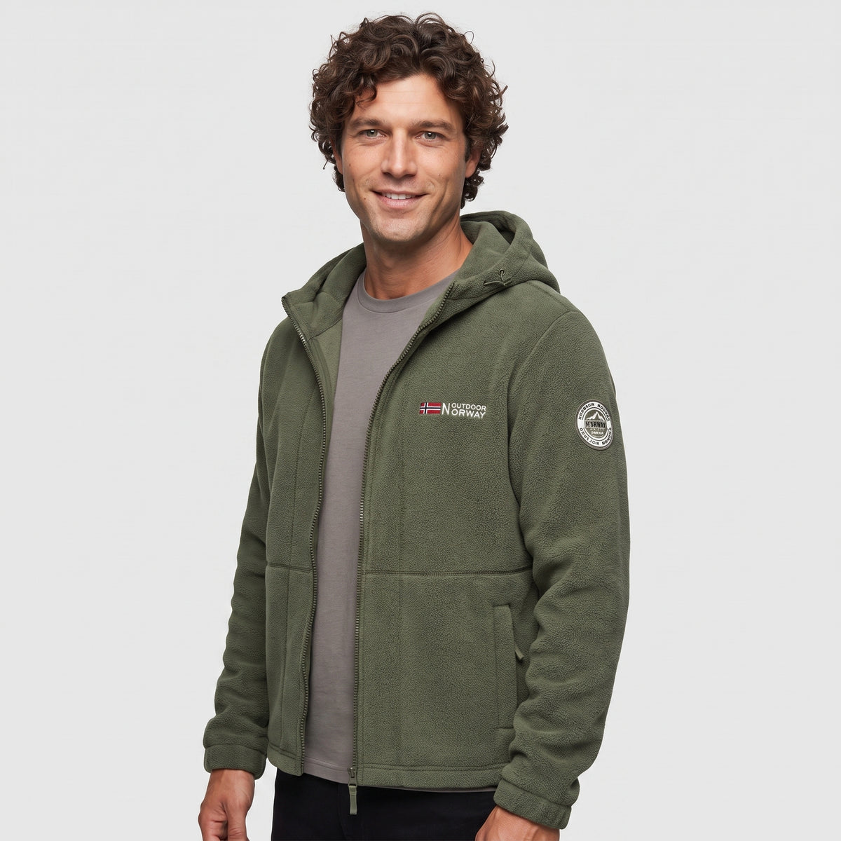 Men's army green windproof fleece jacket worn, three-quarter view