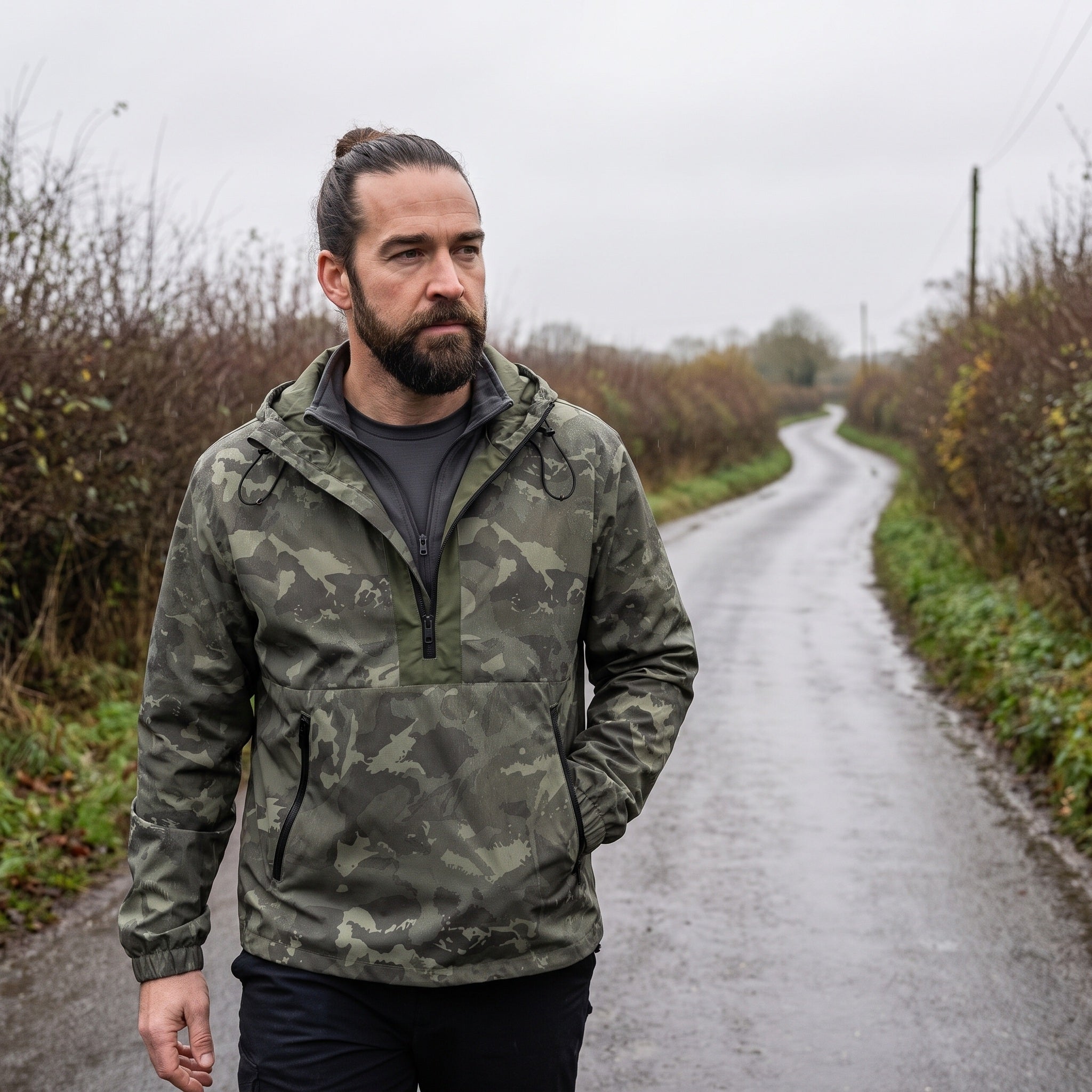 Man wearing the camo anorak on a hedged green lane in overcast weather