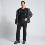 Model wearing black terrabound. ski trousers with base layer and open ski jacket