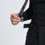 Close-up of detachable suspender clip mechanism, base layer visible