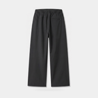 Back view of the women's wide leg walking trousers in black, showing the elasticated back waistband, the curved yoke seam and one rear zip pocket