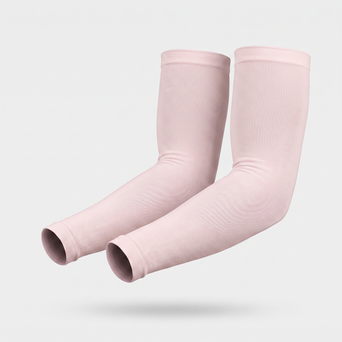 Blush Pink plain cuff UPF 50+ sun sleeves shown on a bent arm, pair