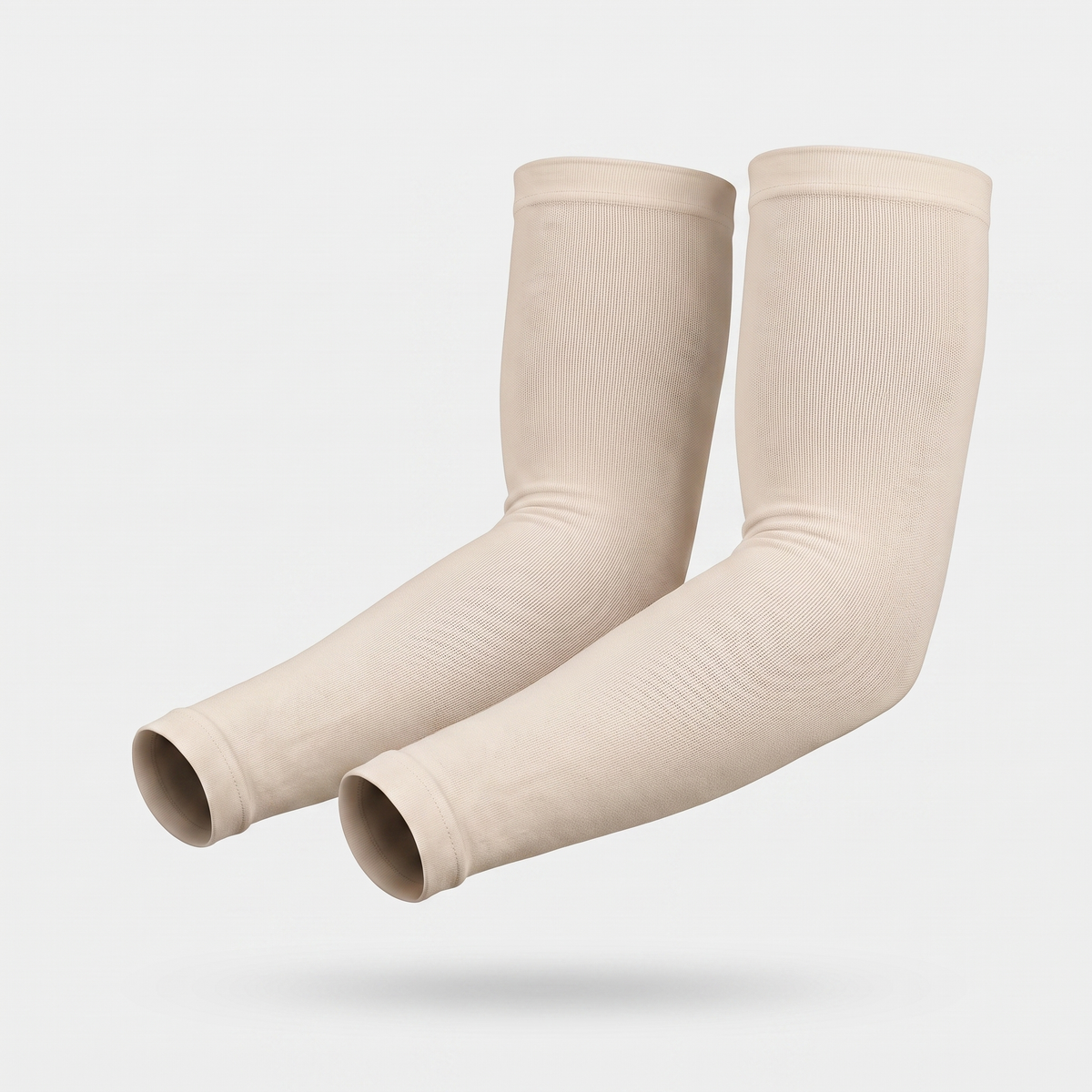 Nude plain cuff UPF 50+ sun sleeves shown on a bent arm, pair