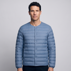 Terrabound Men's Down Jacket in Haze Blue, convertible collar closed, worn front view