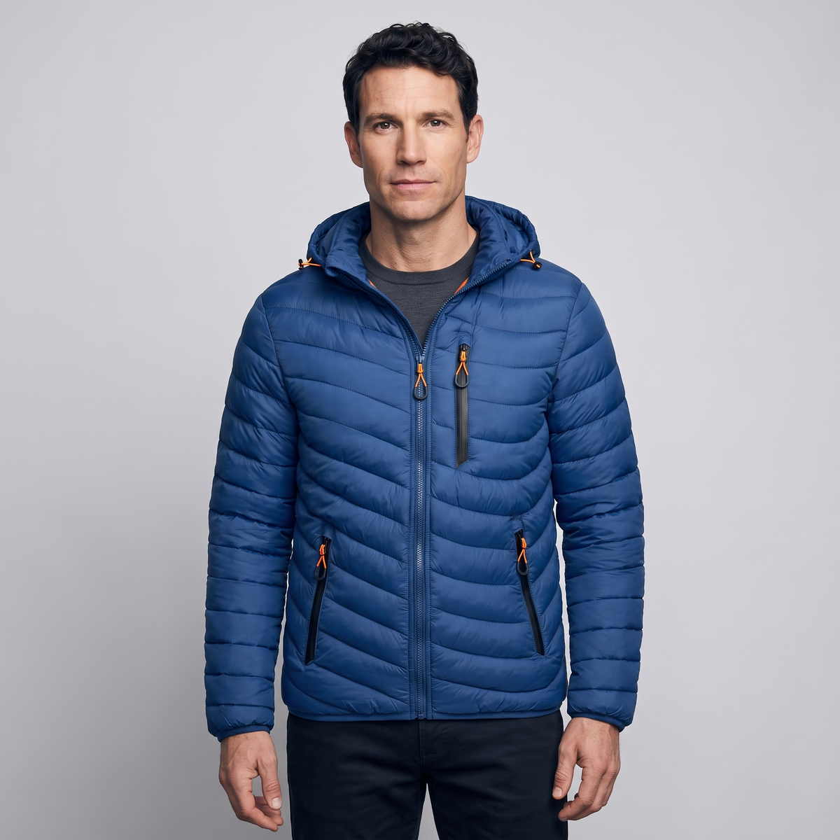 Men's puffer coat in Blue worn by a model
