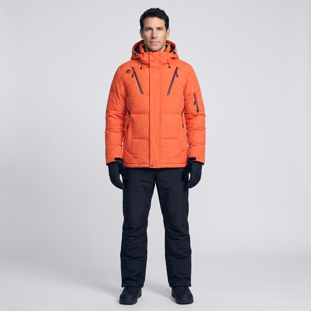 Men's Ski Suit with Orange jacket and black ski trousers, worn full length