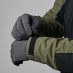 Hook-and-loop cuff tab closing over a glove