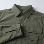 Close-up of the hiking shirt collar, buttons and buttoned cuff