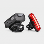 Back of the front bike light with the USB-C port flap, and the rear light's strap mount