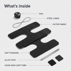 Exploded view of the night splint parts: dial, steel cable, outer fabric, soft padding, alloy stay and hook-and-loop tabs