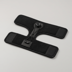 Night splint opened out flat on a table, showing the calf band, foot band, dial and cable