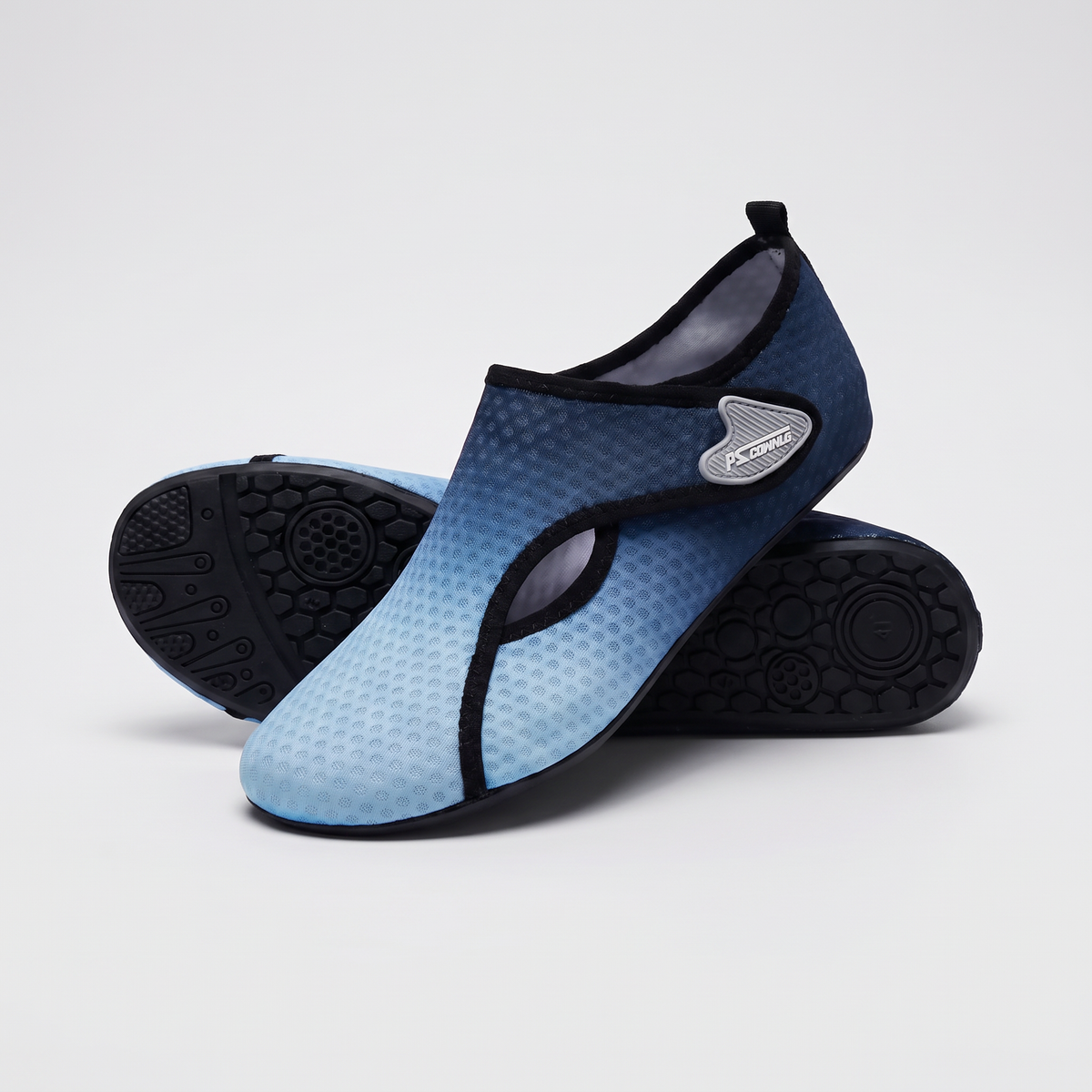 A pair of Terrabound water shoes in Blue showing the tread on the sole