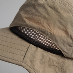 Close-up of the mesh vent on the side of the crown with daylight showing through