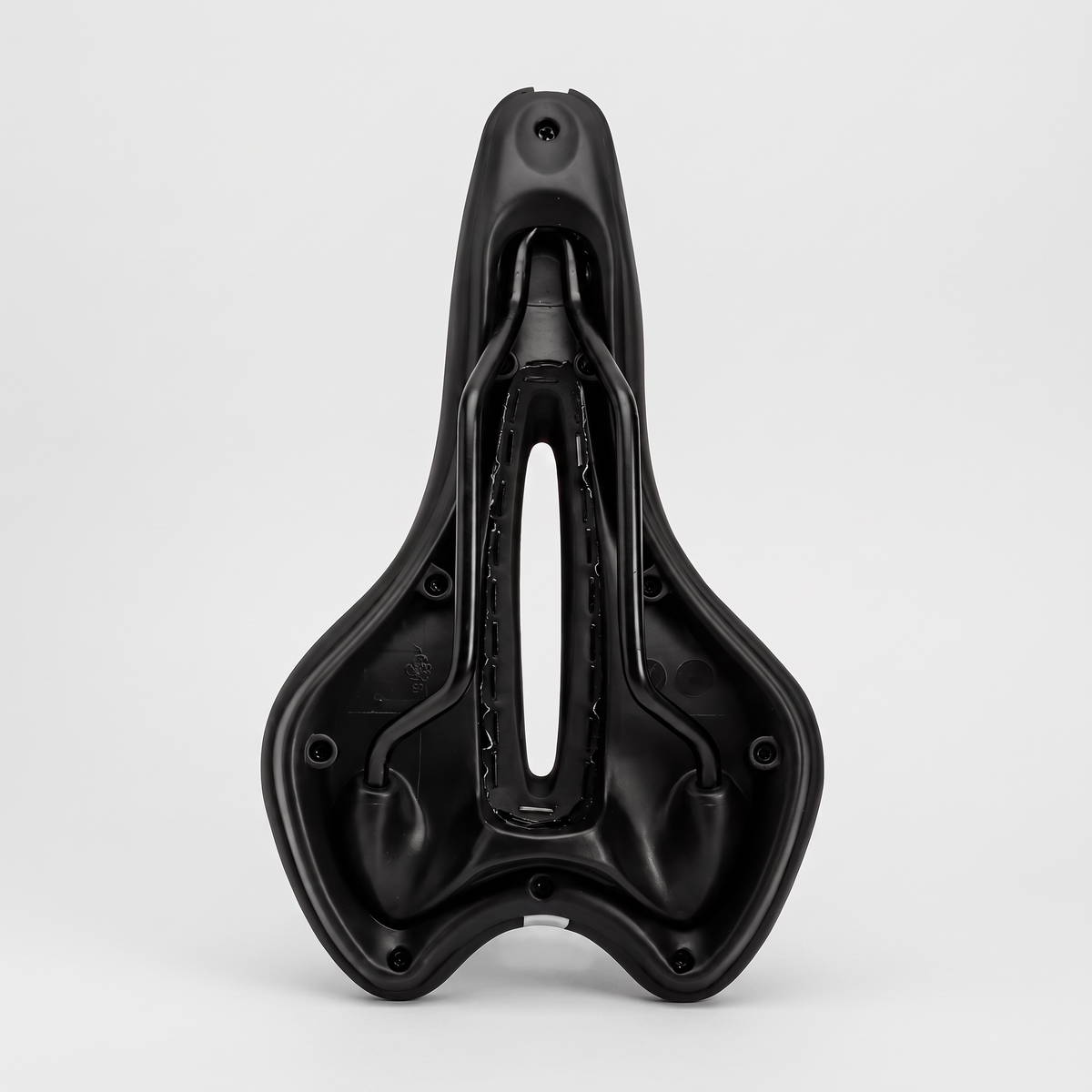 Underside of the gel bike seat showing the twin rails and the cut-out open right through the shell