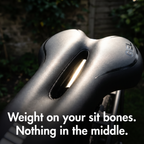 Close-up of light shining through the open cut-out of the gel bike seat