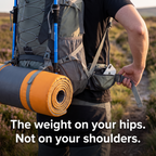Padded hip belt buckled on the hips carrying a full load