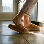 Stepping into Terrabound house slippers on a kitchen floor
