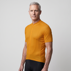 Man wearing the Orange cycling jersey, three-quarter side view