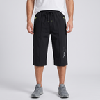 Men's 3/4 shorts in black - worn front view