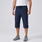 Men's 3/4 shorts in navy - worn front view