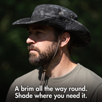 Side view of a man wearing the Terrabound men's boonie hat, the all-round brim shading his face