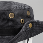 Close-up of the brass mesh vent eyelets and brim press stud on the Terrabound men's boonie hat