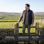 Man at a stile in the Yorkshire Dales wearing the Terrabound men's padded gilet: padded body, 2 zipped pockets, XS to XXXL