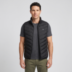 Man wearing the Terrabound men's padded gilet over a grey t-shirt, front view