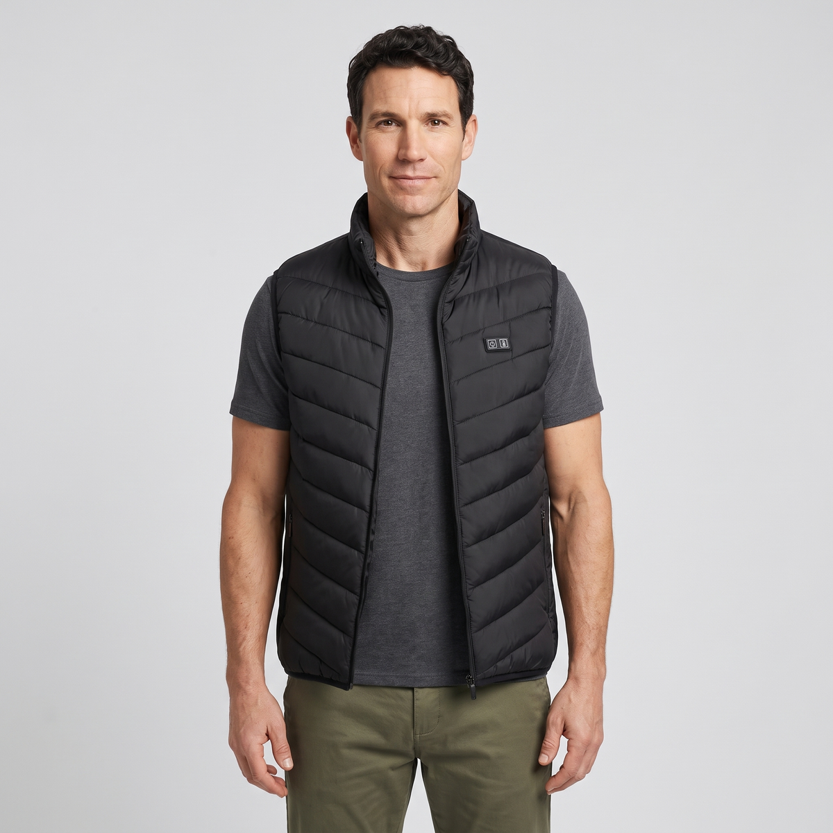 Man wearing the Terrabound men's padded gilet over a grey t-shirt, front view