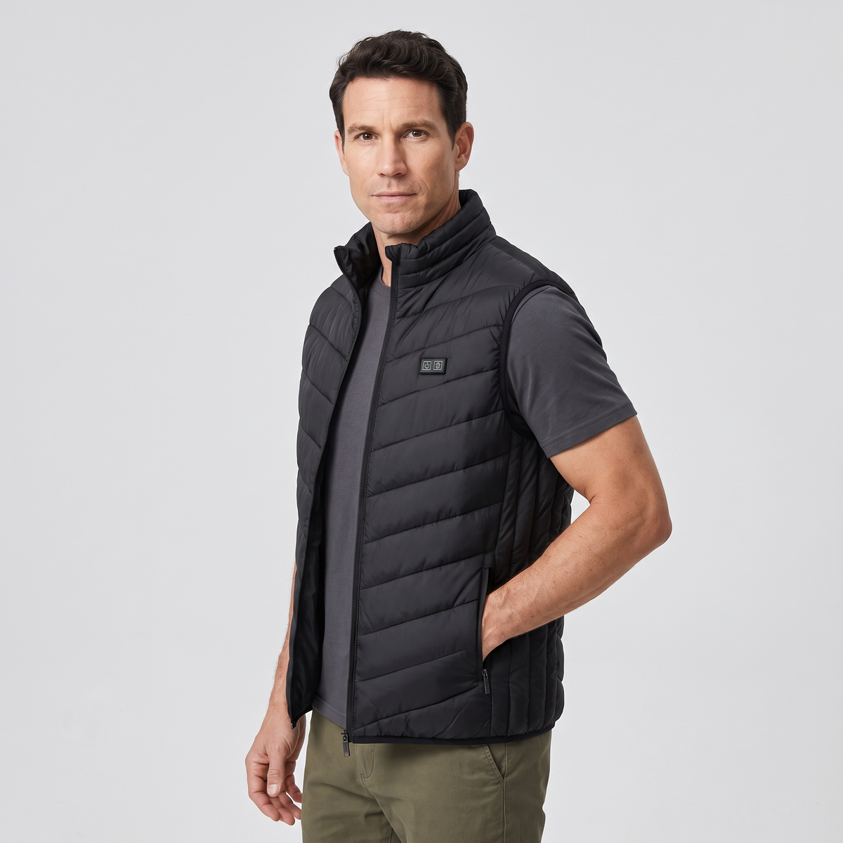 Man wearing the Terrabound men's padded gilet, three-quarter side view, hand in zipped pocket