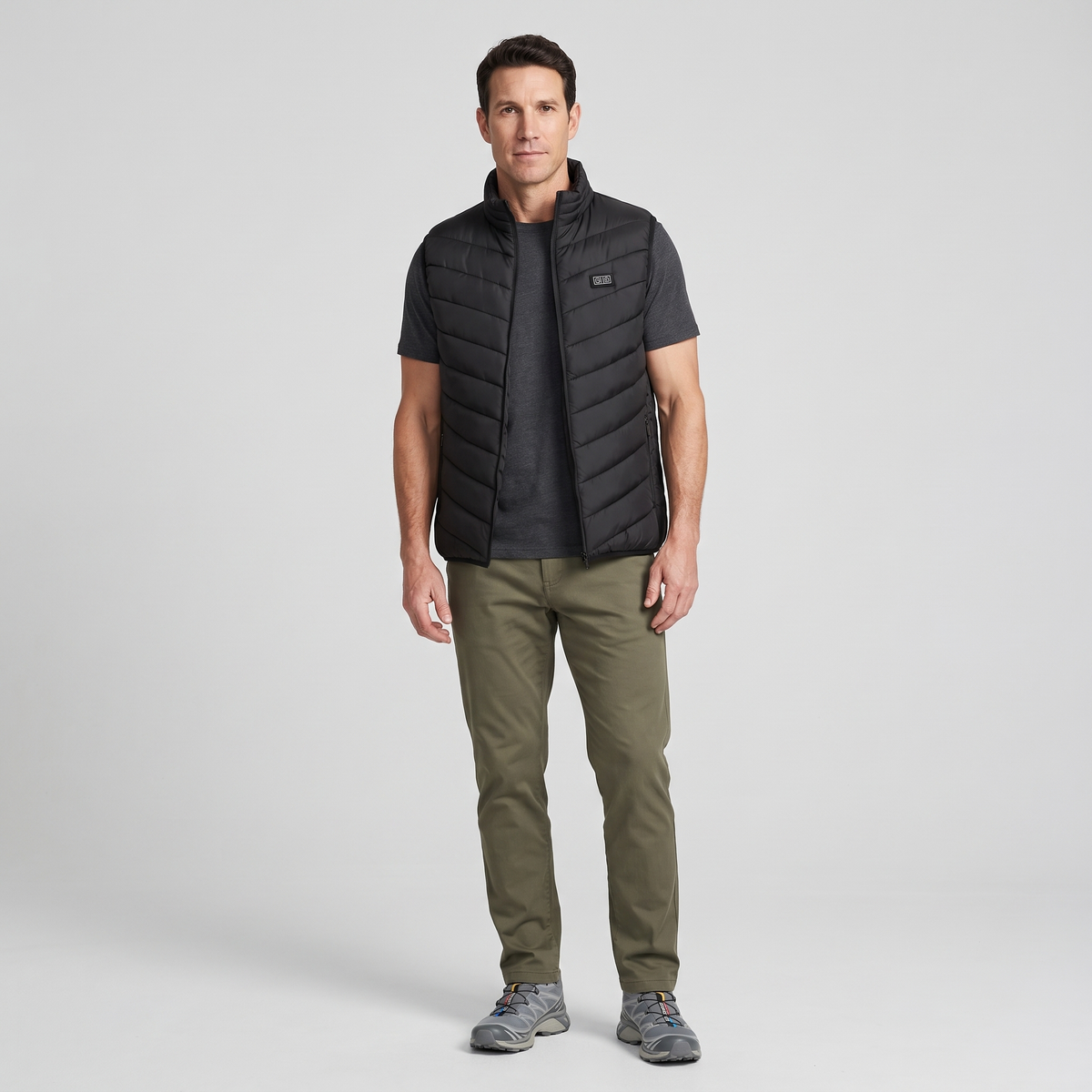 Man wearing the Terrabound men's padded gilet with olive chinos, full length